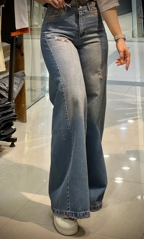 شلوار جین شافل زاپ دار زنانه با تینت صورتی